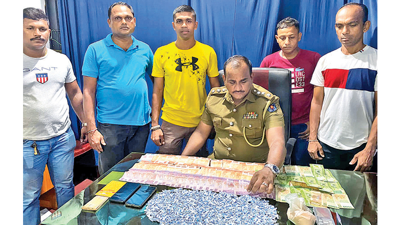 The seized heroin and the officers engaged in the raid to arrest the couple that engaged in drug trafficking on Saturday.