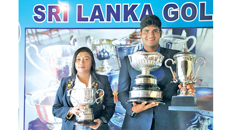 Taniya Balasuriya and Nirekh Tejwani with their trophies