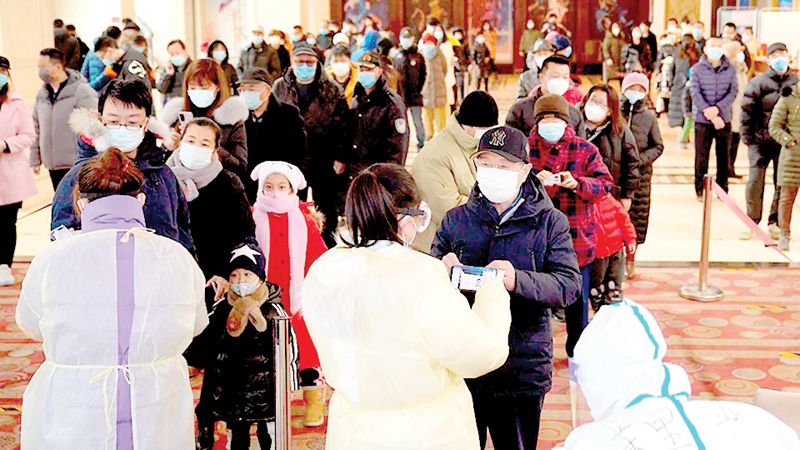 Residents line up to register for COVID-19 tests in Shijiazhuang in China’s Hebei Province.