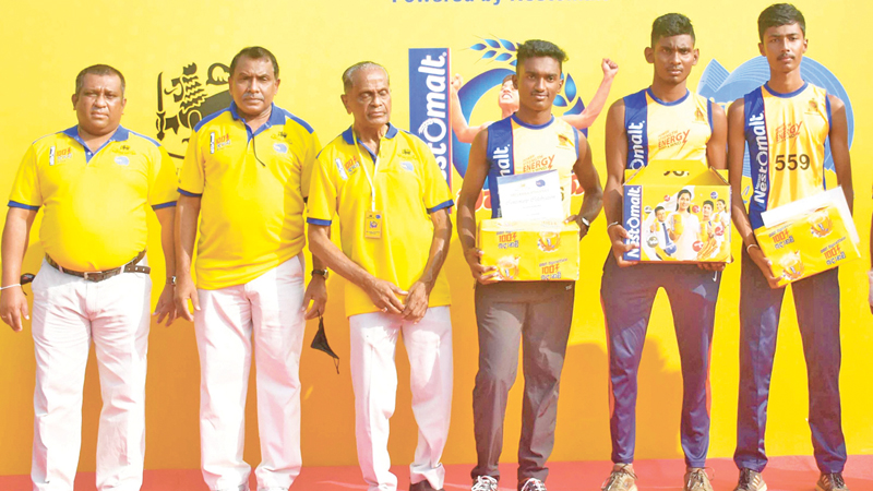Boys top three winners Dulaksha Madushan, Vihanga Promod and Anushka Lakshan with Sajeewa Wickramasinghe-Senior Manager Activations Nestle Lanka PLC, Daya Bandara-Director Sports Ministry of Education, Prema Pinnawela –Secretary SLA