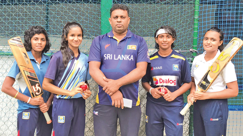 Susantha Basnayake, Cricket Coach with the four Players from left Shalani, Nimeshika, Tharushi and Malshani. (pics. by Upananda Jayasundera-Kandy sports Spl.Corrs