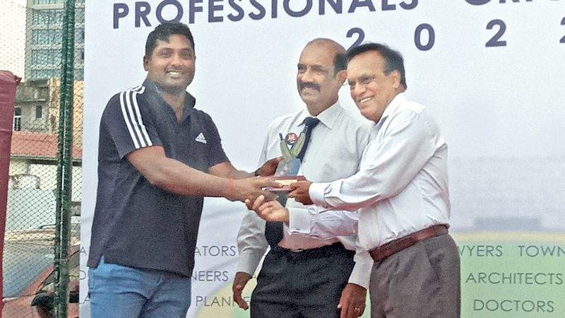 Player of the tournament Rajiv Nirmalasinham receives his trophy from Justice Buwaneka Aluwihare PC.