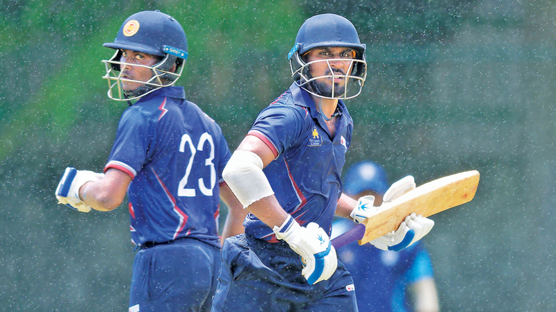Thaveesha Abishek and Promod Maduwantha running between the wickets. The pair added 65 runs during their second-wicket stand. (Pic courtesy SLC)