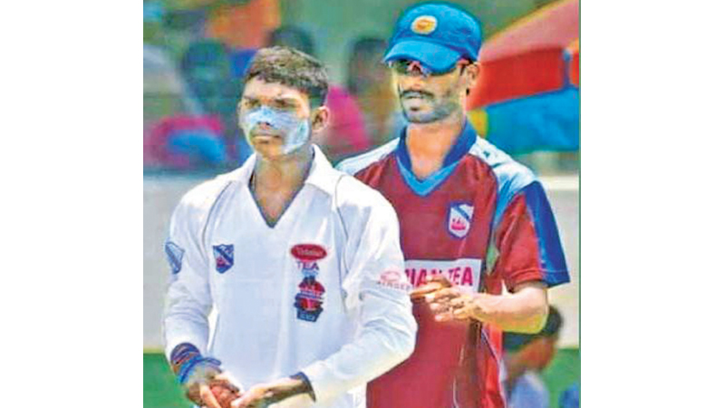 Wanindu Hasaranga and his school coach Lakmal de Silva during their training session
