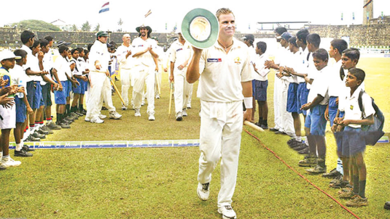 Shane Warne returning to the pavilion after taking his 500th Test wicket at Galle in 2004