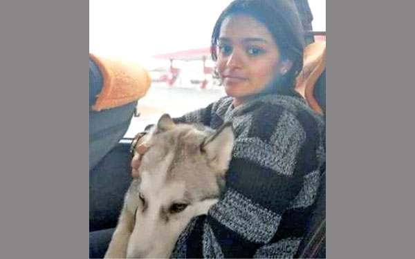 Arya with her dog.