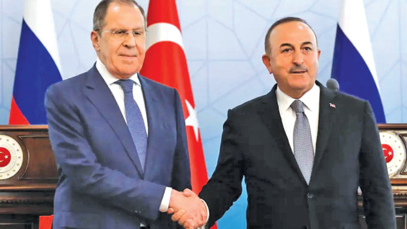 Russian Foreign Minister Sergey Lavrov, (L), and Turkish Foreign Minister Mevlut Cavusoglu shake hands at the end of a joint news conference in Ankara, Wednesday,