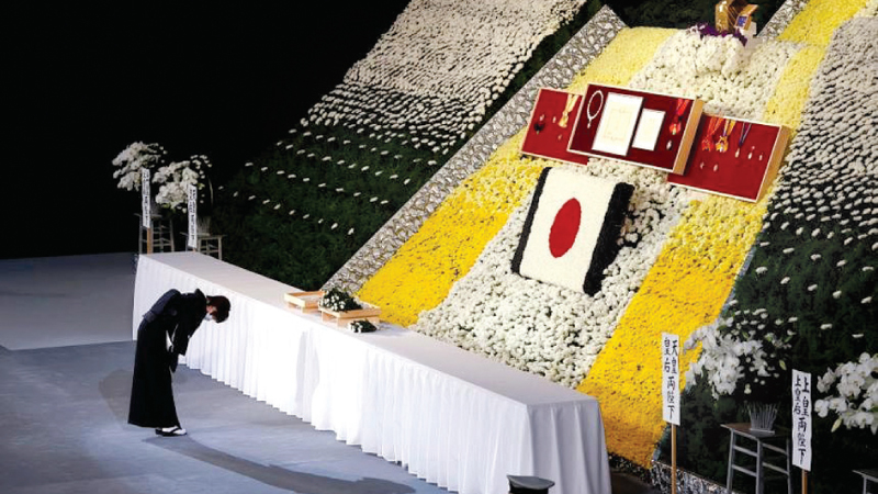 Mrs Akie Abe, widow of former Japanese Prime Minister Shinzo Abe, bowing in front of the alter during his State Funeral. 