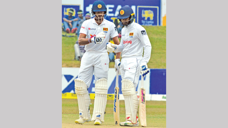 Skipper Dimuth Karunaratne and Dhananjaya de Silva congratulating each other. The pair added fighting sixth wicket partnership to build the innings while Dhananjaya made his 9th Test century. (pic. by Hirantha Gunathilaka)