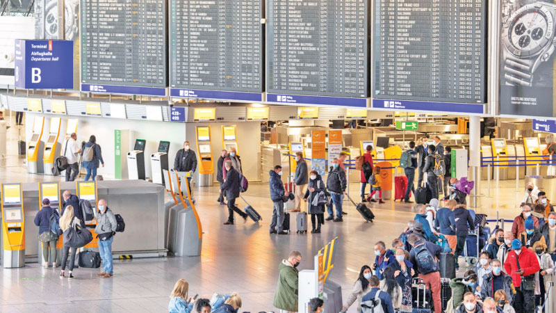Passengers at Schiphol Airport in the Netherlands amid the spread of the Omicron variant.