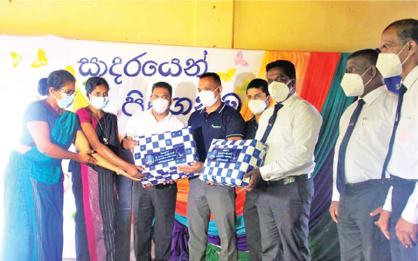 SLT officials make a donation at the event