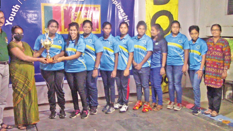 Open Women's champions Jaffna University team receiving the trophy.