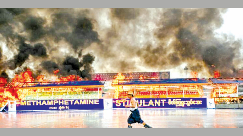 A burning pile of seized illegal drugs during a destruction ceremony to mark the United Nations' "International Day against Drug Abuse and Illicit Trafficking" in Yangon on Sunday.