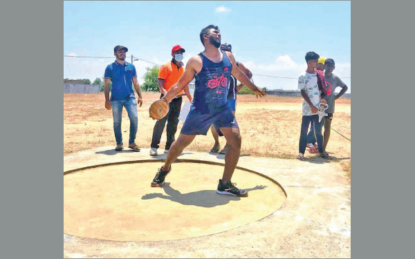 Addalaichenai Marksmen Sports Club Athlete R. Nowshad on his way to a record in the discus throw event.