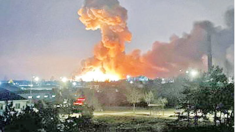 Explosions can be seen near Kharkiv, Ukraine, in the early morning hours of February 24 as Russian military forces invade Ukraine.