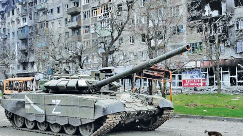 Russia gave Ukrainian fighters still holding out in Mariupol a fresh ultimatum to surrender on Wednesday as some Ukrainian fighters and civilians are holding out in a steel plant in the city. Here, a cat walking in front of a Russian tank.