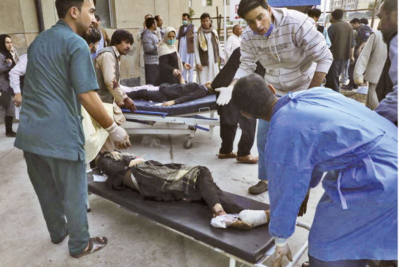Injured Afghan students being taken to hospital after the blasts.