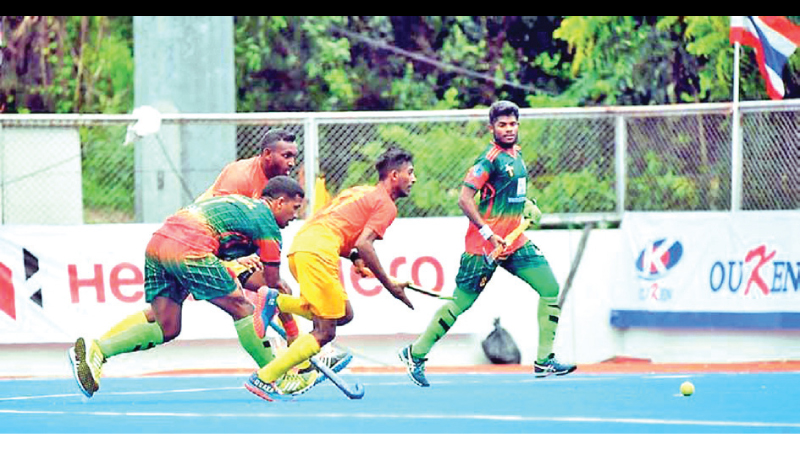 Action at the Sri Lanka- Bangladesh hockey match at the Asian Games qualifying Hockey tournament in Bangkok.