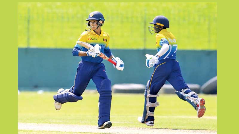 Raveen de Silva (left) and Pawan Pathiraja who put on 111 runs fifth wicket stand making a run. (Pic. courtesy SLC)