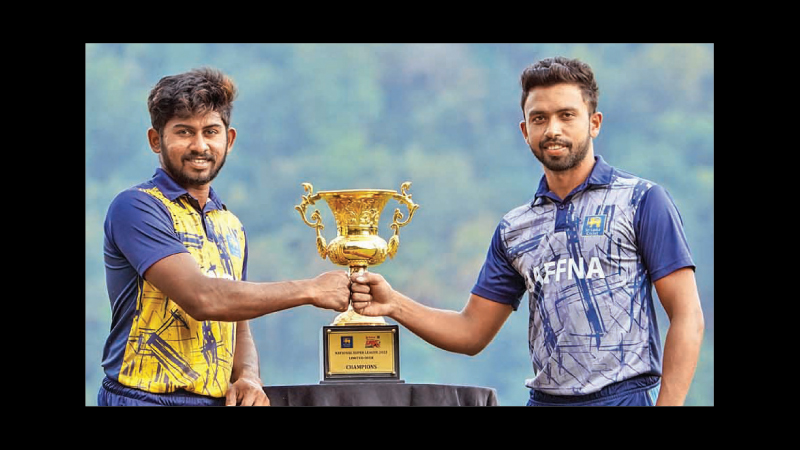 Kandy captain Kamindu Mendis and Jaffna captain Sadeera Samarawickrama pose with the champions trophy.