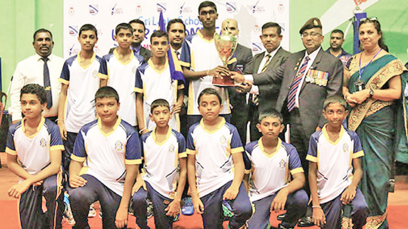 Champion Rahula College, Matara shuttlers with the trophy