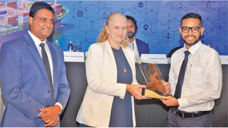 Cosco Shipping Lines Lanka (Pvt) Ltd Head Of Commercial Gayan de Alwis receives an award from Norwegian Ambassador to Sri Lanka and the Maldives Trine Jøranli Eskedal at the awards ceremony. Picture by Sudath Malaweera