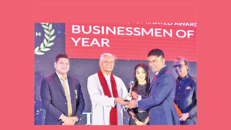 Chairman of DHS Gems, Prof. Duminda De Silva receiving the award from Minister of Irrigation Chamal Rajapaksa