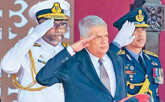 President Ranil Wickremesinghe and the Forces Chiefs take the salute at the Independence Day Parade yesterday. Pictures by Sulochana Gamage. 