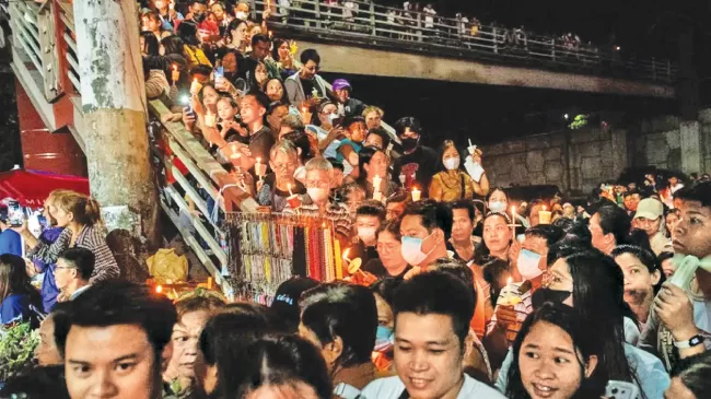 In the Philippines, worshippers crowded along a staircase to get a glimpse of the traditional procession.